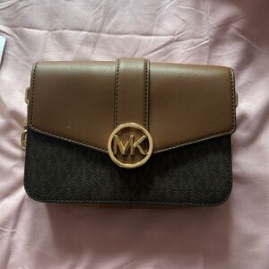 Im selling a Small Brown Michael Kors purse